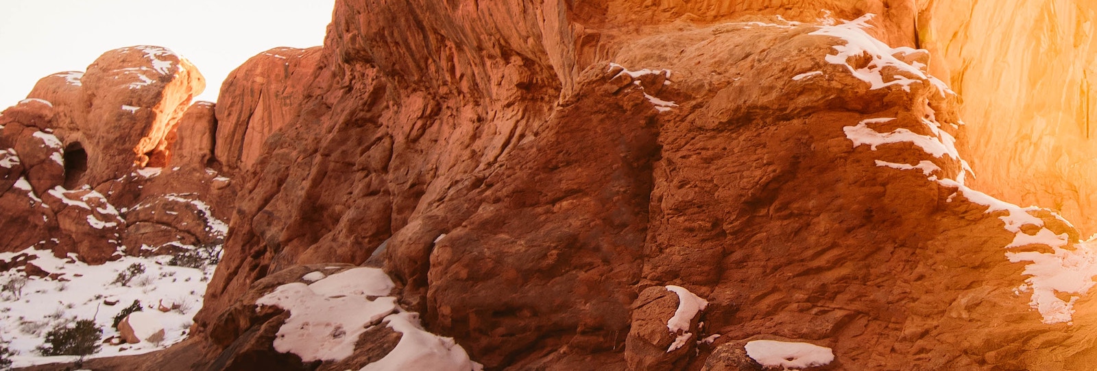 Red rock formation with sunlight streaming in.