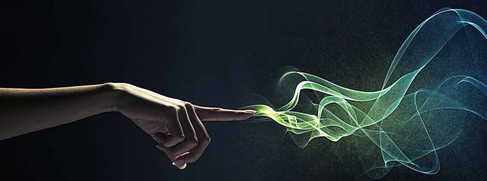 Finger magically pointing with green fire coming out of the tip.